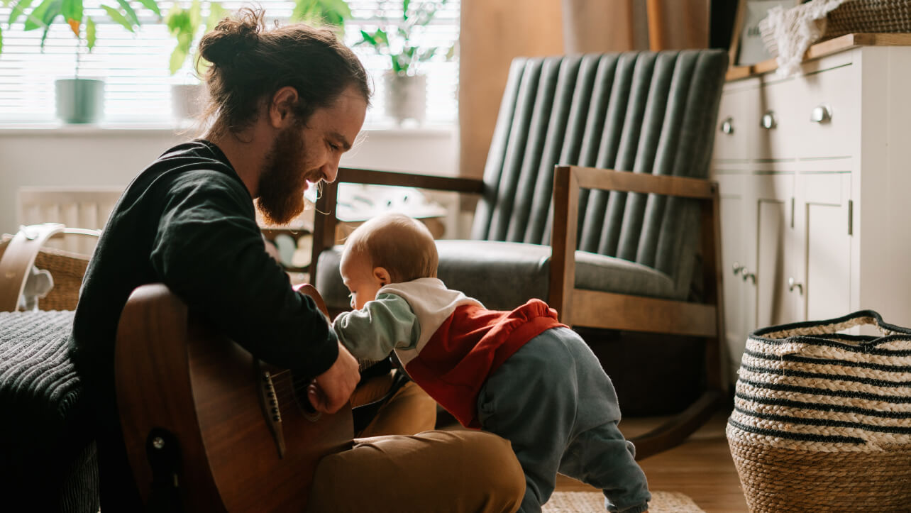 a Music & Arts customer playing the guitar