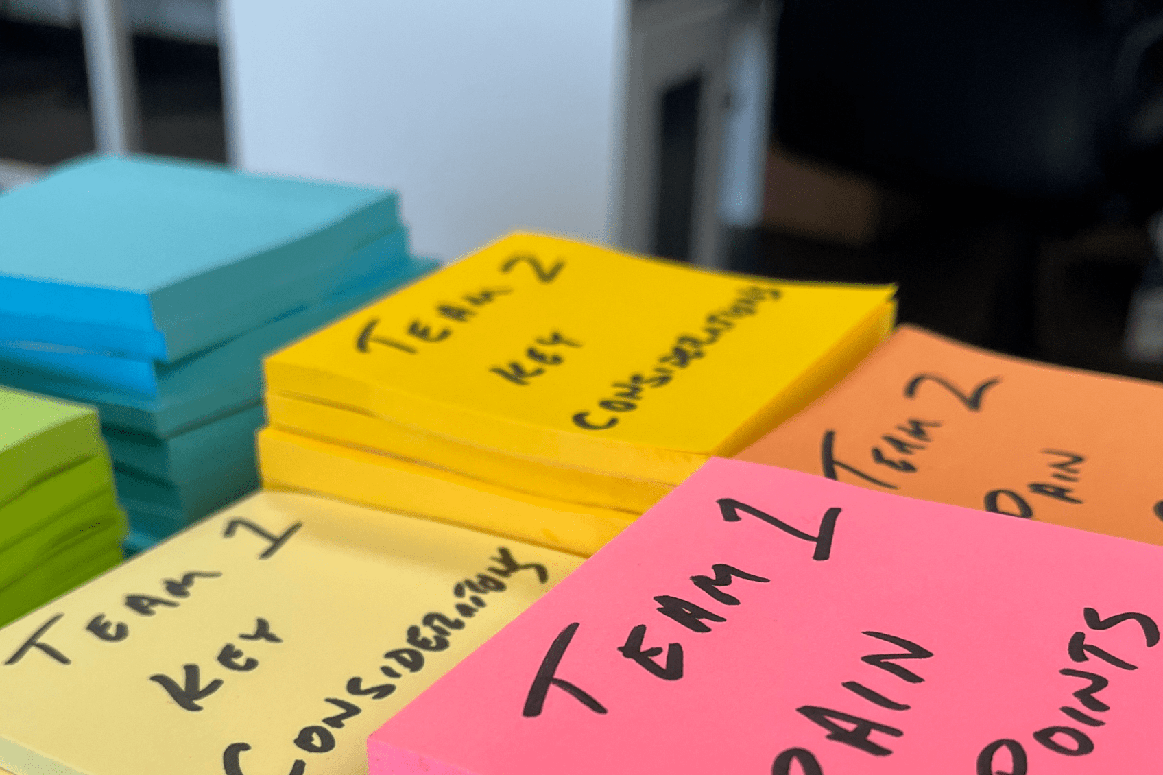 A stack of sticky notes for use in a customer experience workshop